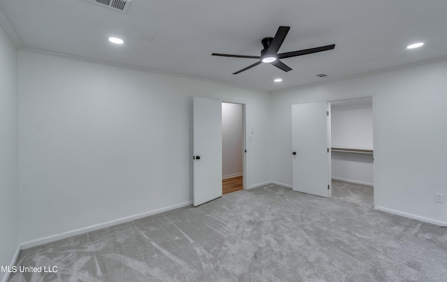 551 Holly Bush Rd, Brandon, MS 39047 - unfurnished bedroom with carpet floors, recessed lighting, a walk in closet, baseboards, and ceiling fan
