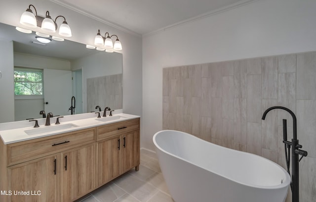 551 Holly Bush Rd, Brandon, MS 39047 - bathroom with a freestanding bath, tile patterned floors, double vanity, tile walls, and ornamental molding