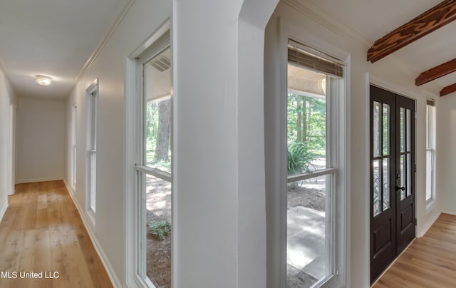 551 Holly Bush Rd, Brandon, MS 39047 - hall with beam ceiling, arched walkways, light wood-style flooring, and french doors