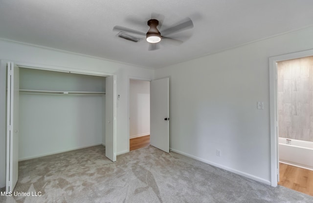 551 Holly Bush Rd, Brandon, MS 39047 - unfurnished bedroom featuring carpet flooring, a closet, a ceiling fan, and baseboards