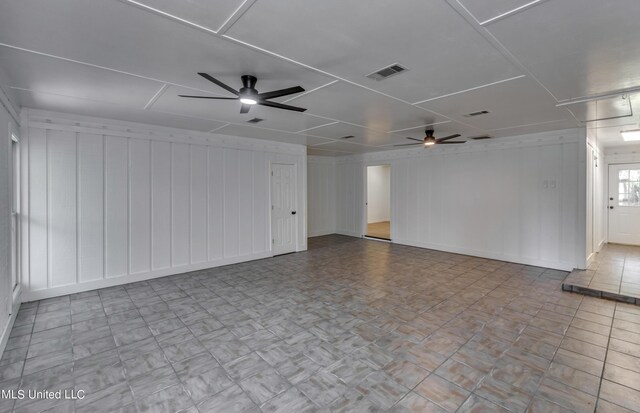551 Holly Bush Rd, Brandon, MS 39047 - spare room with ceiling fan, wooden walls, and baseboards