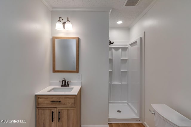 551 Holly Bush Rd, Brandon, MS 39047 - full bathroom featuring toilet, crown molding, a textured ceiling, a stall shower, and vanity