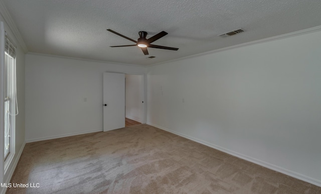 551 Holly Bush Rd, Brandon, MS 39047 - spare room with carpet flooring, a ceiling fan, crown molding, a textured ceiling, and baseboards
