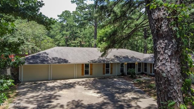 551 Holly Bush Rd, Brandon, MS 39047 - ranch-style house featuring driveway, an attached garage, and roof with shingles