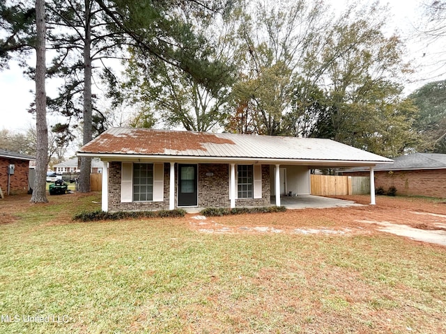 view of front of property with a carport and a front yard