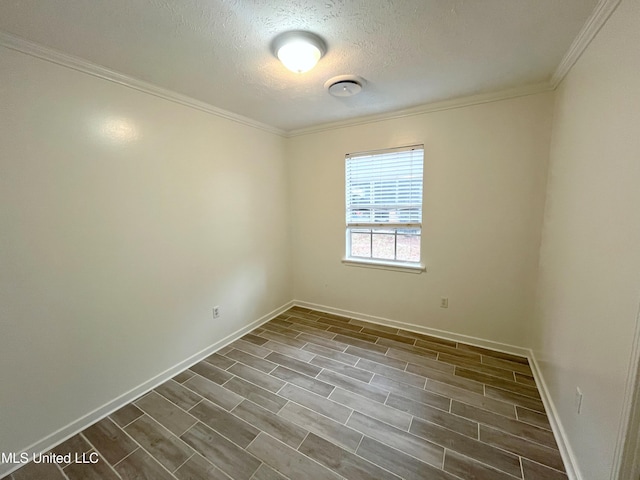 unfurnished room featuring wood-type flooring, a textured ceiling, and ornamental molding