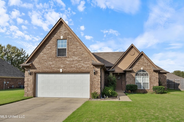 view of property with a garage and a front yard