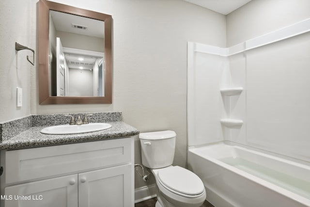 full bathroom featuring shower / bathing tub combination, vanity, and toilet