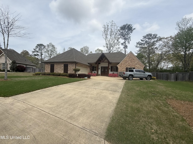 view of front of house with a front yard, brick siding, concrete driveway, an attached garage, and fence