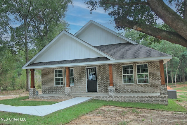 view of front of house featuring a porch and cooling unit