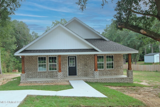 view of front of house featuring a front yard and a porch