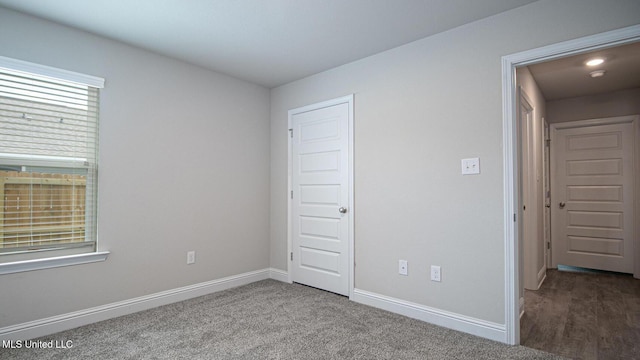 32 Crown Dr, Lucedale, MS 39452 - unfurnished bedroom with baseboards and carpet
