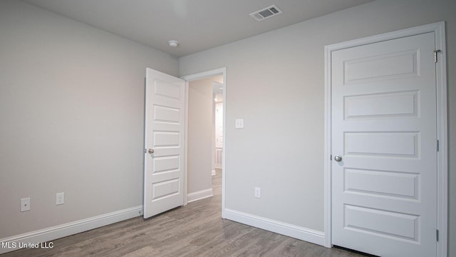 32 Crown Dr, Lucedale, MS 39452 - unfurnished bedroom with wood finished floors and baseboards