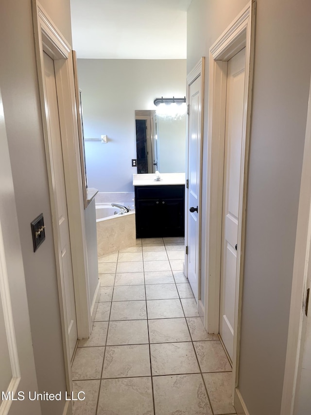 4896 Park N Dr, Olive Branch, MS 38654 - hallway with light tile patterned floors and a sink