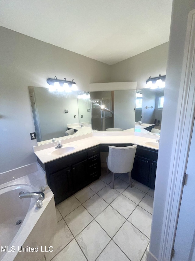 4896 Park N Dr, Olive Branch, MS 38654 - bathroom featuring double vanity, tile patterned flooring, and a garden tub