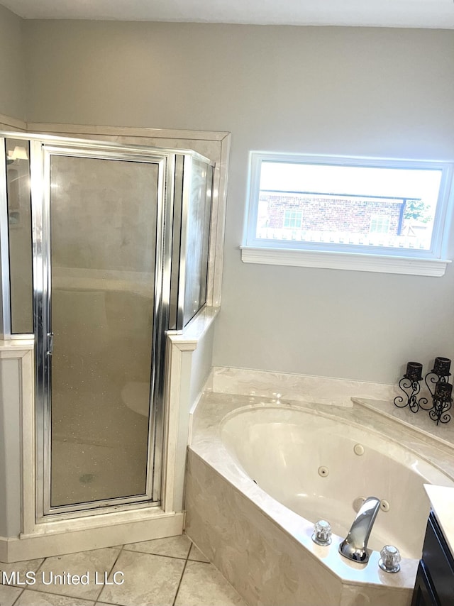 4896 Park N Dr, Olive Branch, MS 38654 - full bath featuring a jetted tub, a shower stall, tile patterned floors, and vanity
