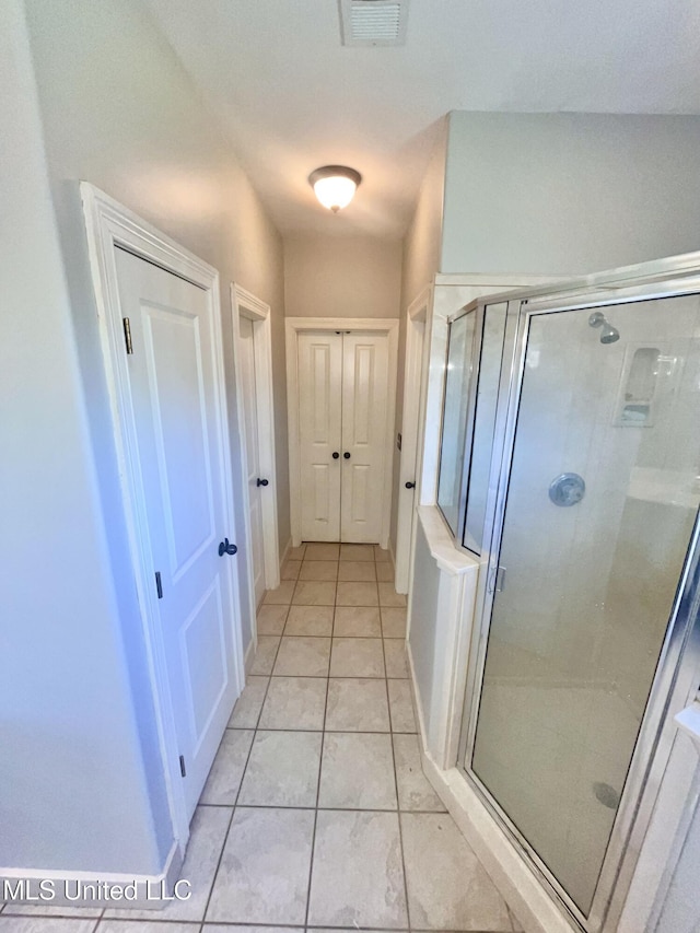 4896 Park N Dr, Olive Branch, MS 38654 - full bathroom with a shower stall and tile patterned flooring