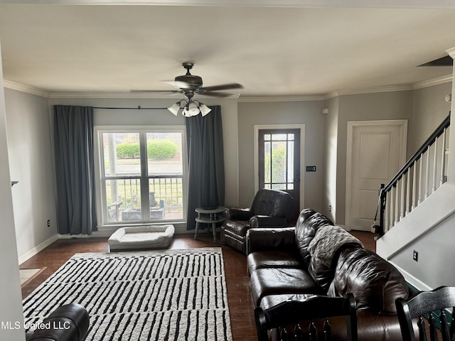 4896 Park N Dr, Olive Branch, MS 38654 - living room featuring plenty of natural light, a ceiling fan, ornamental molding, stairway, and baseboards