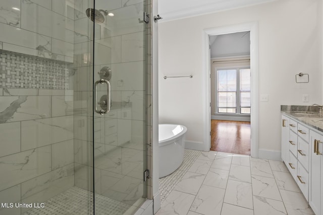 bathroom with separate shower and tub, vanity, and ornamental molding