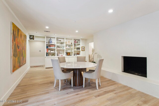 dining space featuring light hardwood / wood-style floors