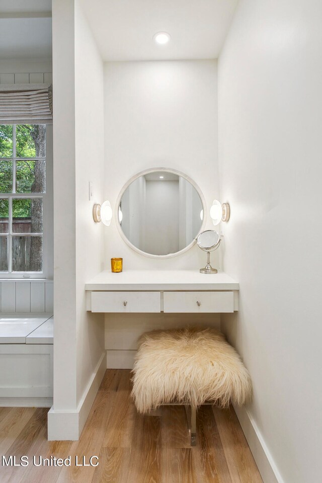 bathroom with hardwood / wood-style flooring