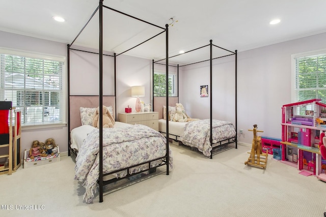 bedroom featuring recessed lighting, multiple windows, and carpet floors