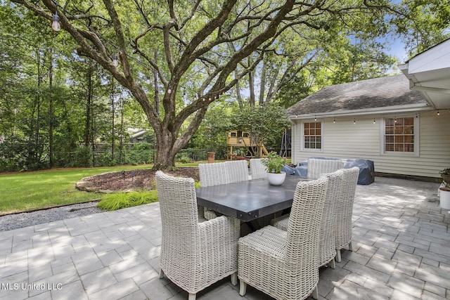 view of patio / terrace featuring fence and outdoor dining space