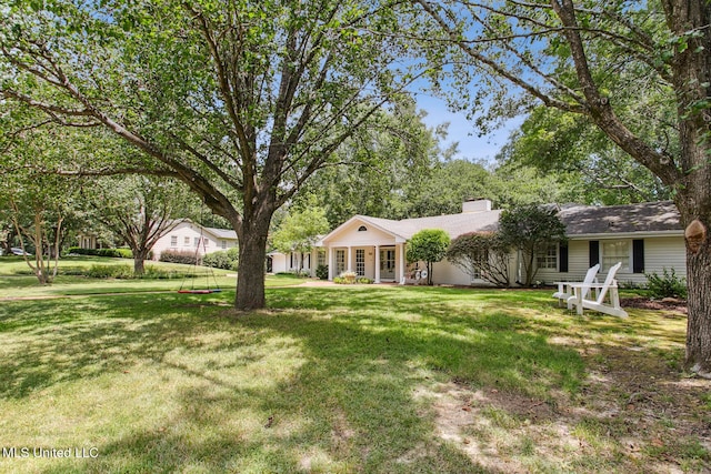 ranch-style home featuring a front lawn