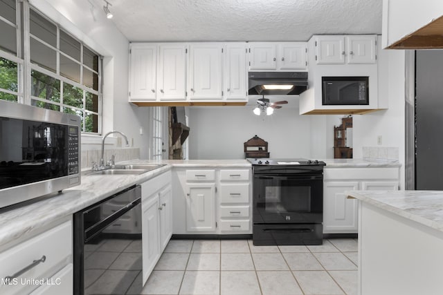 kitchen with ceiling fan, under cabinet range hood, a sink, light tile patterned floors, and black appliances