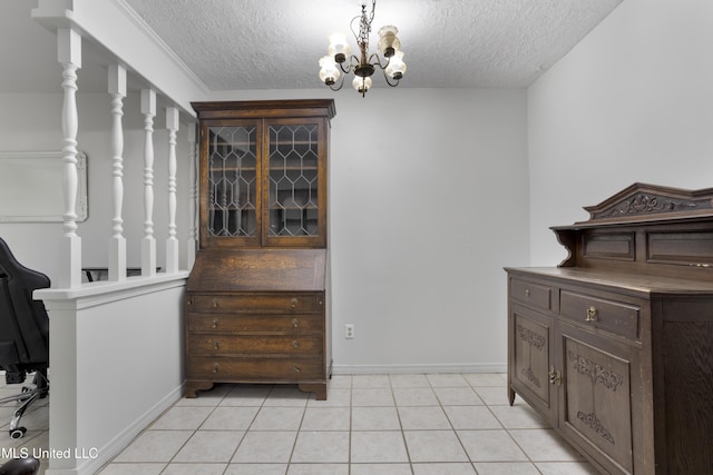 dining area featuring an inviting chandelier, baseboards, light tile patterned flooring, and a textured ceiling