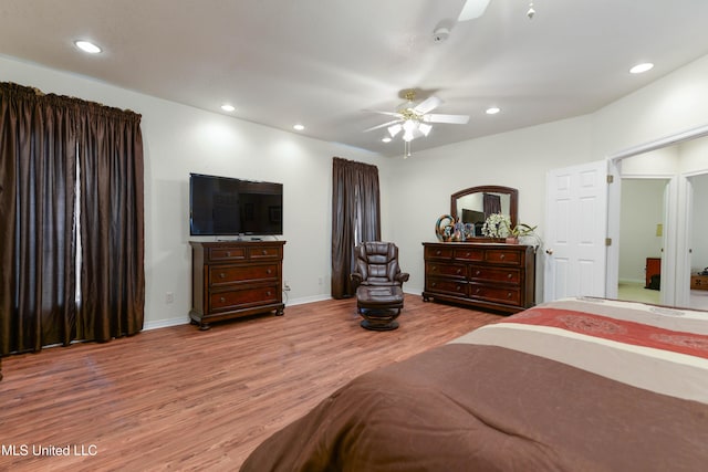 bedroom with ceiling fan and light hardwood / wood-style flooring