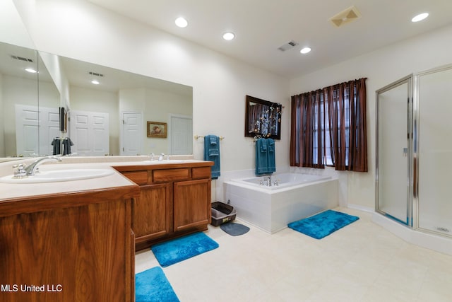 bathroom featuring vanity and shower with separate bathtub