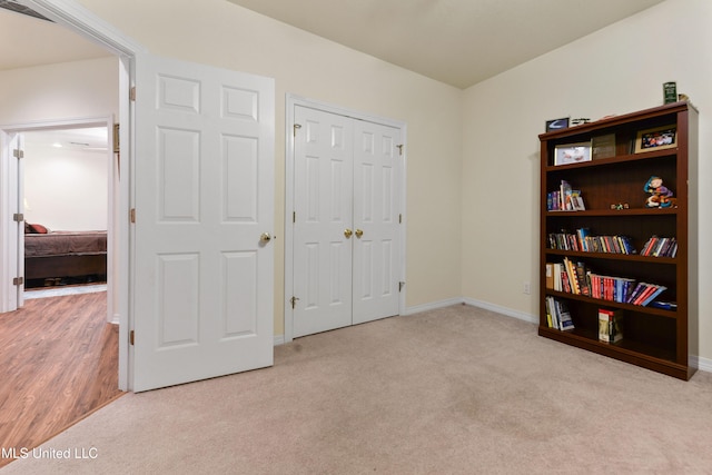 carpeted bedroom with a closet