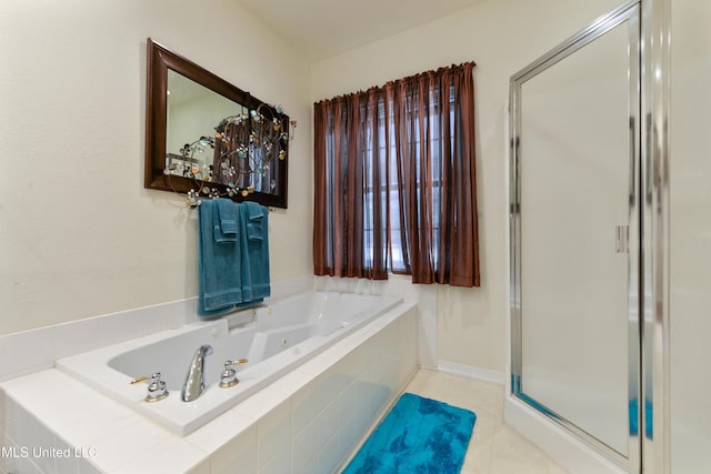 bathroom with tile patterned floors and separate shower and tub