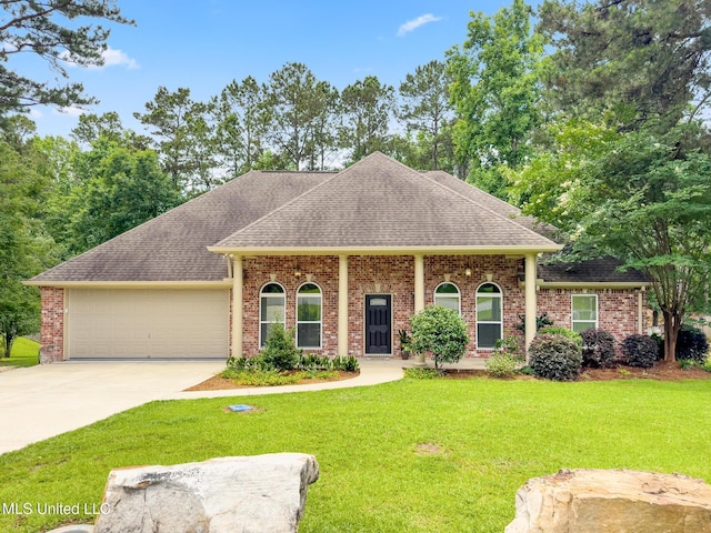 66 Auburn Pl, Hattiesburg, MS 39402 - view of front of home with a garage, driveway, a shingled roof, and a front lawn