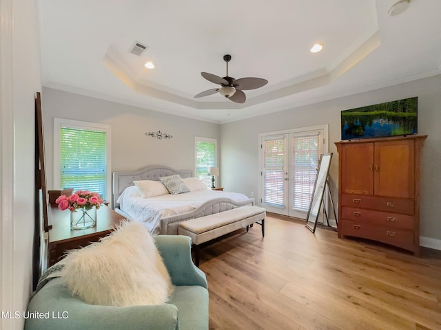 66 Auburn Pl, Hattiesburg, MS 39402 - bedroom with a tray ceiling, access to outside, light wood-type flooring, ornamental molding, and french doors