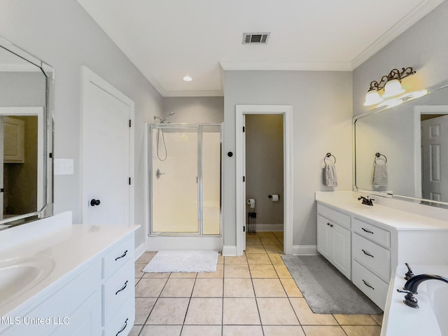 66 Auburn Pl, Hattiesburg, MS 39402 - bathroom featuring a stall shower, two vanities, ornamental molding, tile patterned floors, and a bath