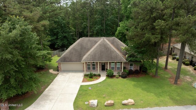 66 Auburn Pl, Hattiesburg, MS 39402 - view of front of property with an attached garage, brick siding, driveway, and a front lawn