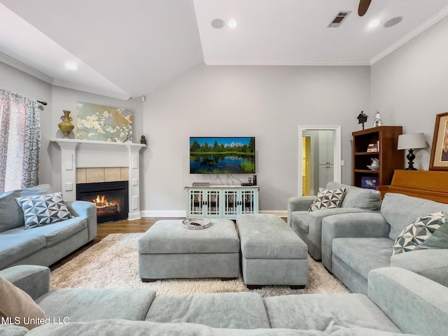 66 Auburn Pl, Hattiesburg, MS 39402 - living room featuring a tile fireplace, wood finished floors, baseboards, recessed lighting, and lofted ceiling