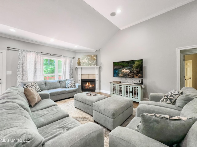 66 Auburn Pl, Hattiesburg, MS 39402 - living room featuring ornamental molding, a tiled fireplace, vaulted ceiling, and recessed lighting