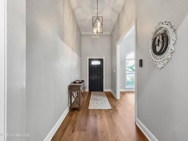 66 Auburn Pl, Hattiesburg, MS 39402 - foyer with wood finished floors, baseboards, a chandelier, and crown molding
