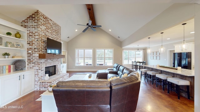 living room featuring ceiling fan, high vaulted ceiling, built in features, a brick fireplace, and beam ceiling