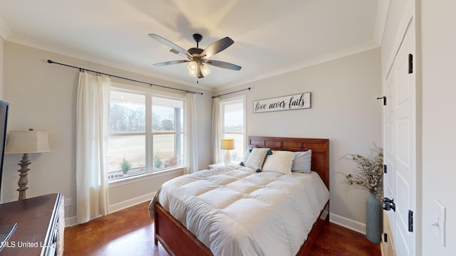 bedroom with ceiling fan, dark hardwood / wood-style flooring, and ornamental molding