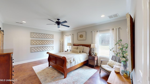 bedroom featuring ceiling fan, multiple windows, and a barn door