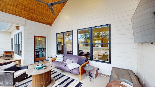 view of patio with ceiling fan and an outdoor living space