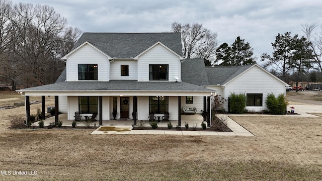 view of front of home with a front lawn and covered porch