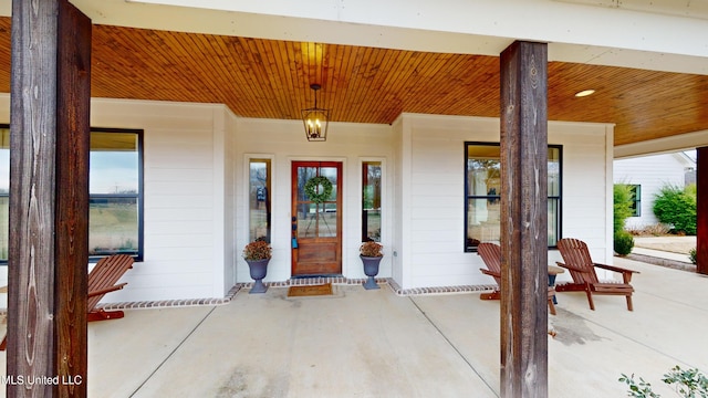 doorway to property with a porch