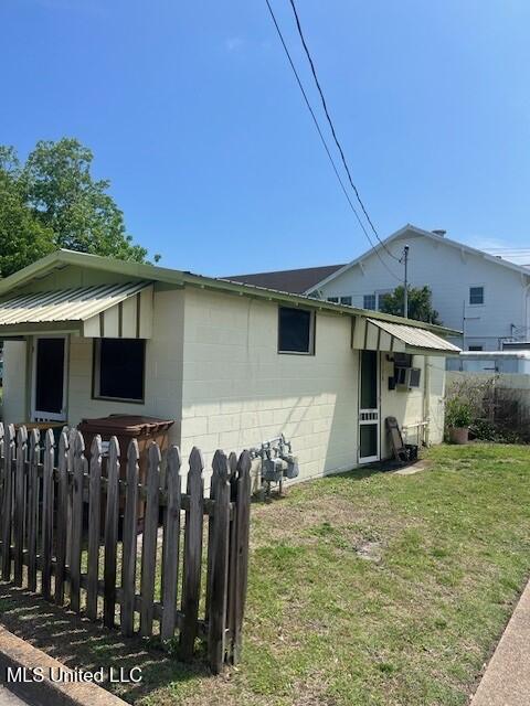 128 Thomas St, Biloxi, MS 39530 - view of side of property featuring concrete block siding