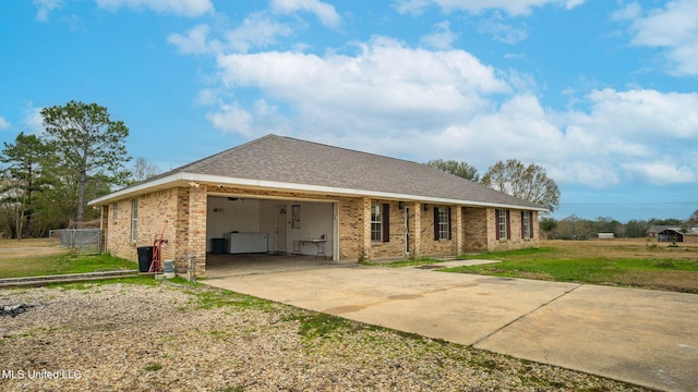 8 Skeeter Ln, Carriere, MS 39426 - view of front of home featuring driveway, an attached garage, brick siding, and roof with shingles