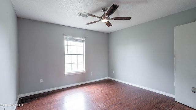 8 Skeeter Ln, Carriere, MS 39426 - spare room featuring wood finished floors, a ceiling fan, a textured ceiling, and baseboards